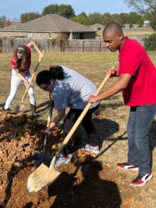 friends planting a tree